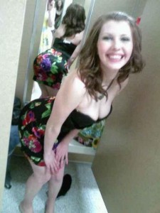 Busty brunette in a dressing room