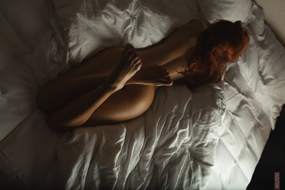 Redhead on a bed.