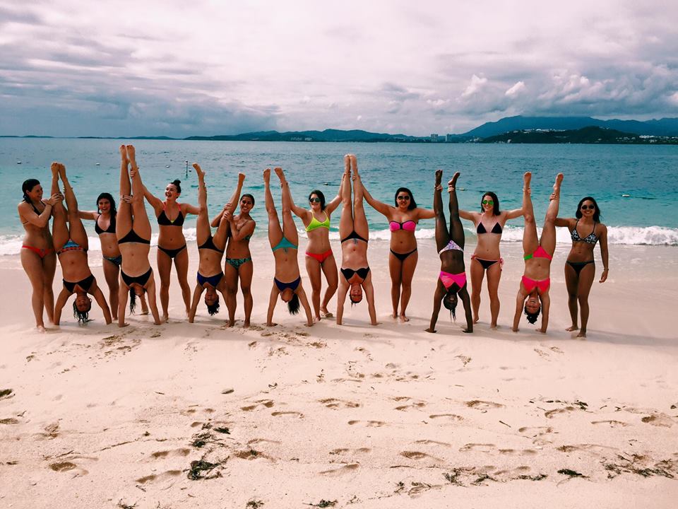 Hand stands on the beach