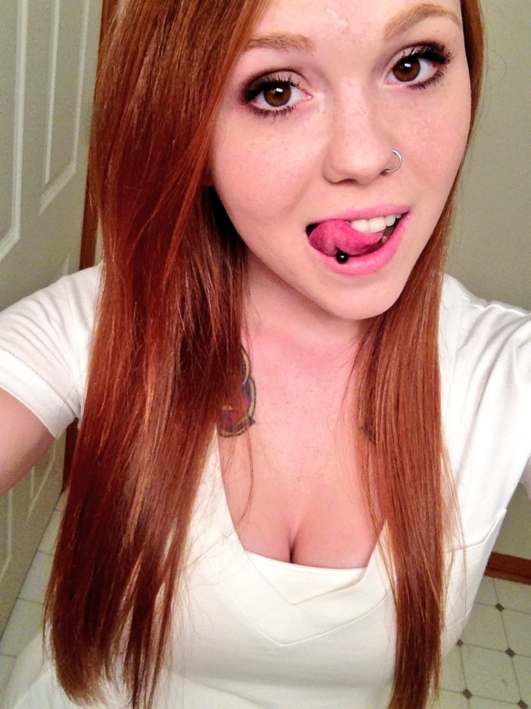 Sexy girl with pierced tongue.