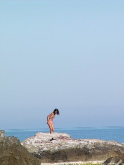 Cute teenager nude at the bare beach