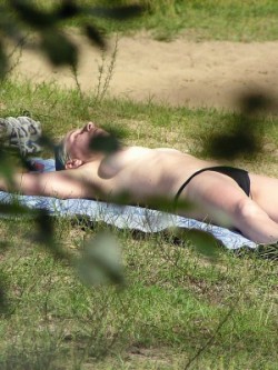 Nude individuals at the tiny public beach