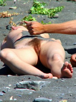 Hairy pussy MILF sunbathing at the beach