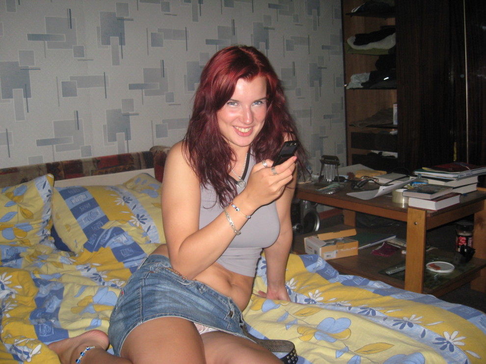 Fluffy redhead on her phone