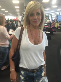 Blonde MILF slut showing cleavage