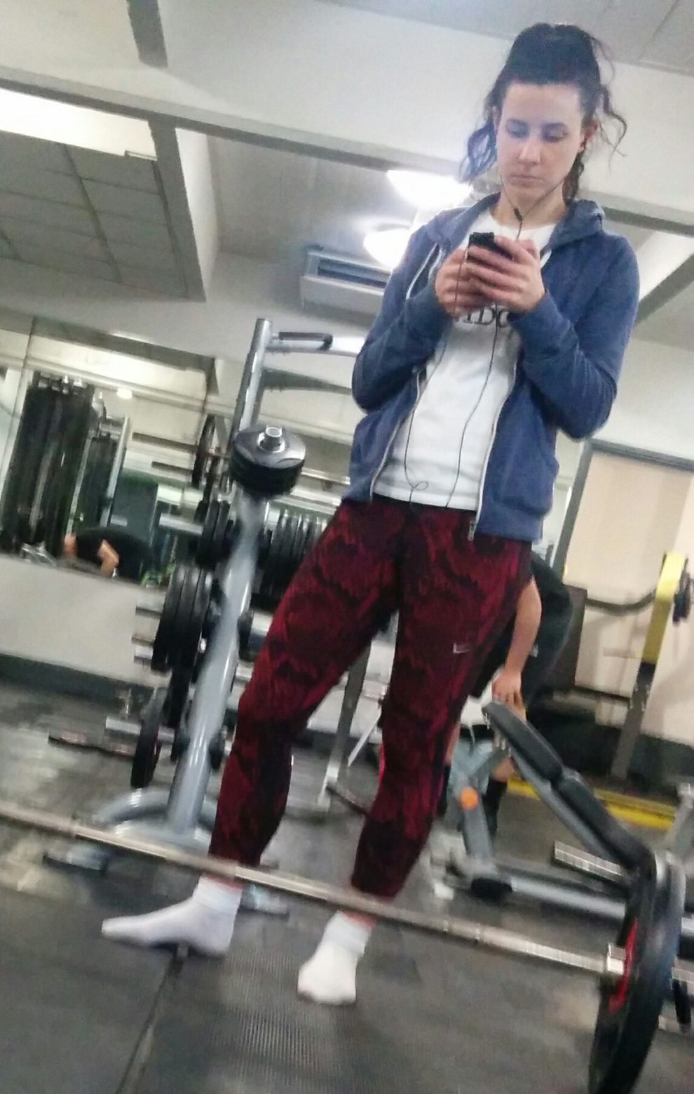 Gym pixie without shoes doing deadlift