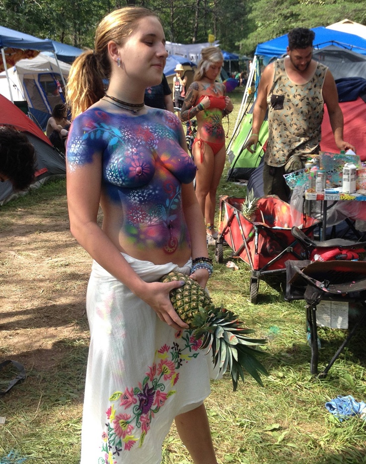 Looks Like She's Holding A Juicy Pineapple!