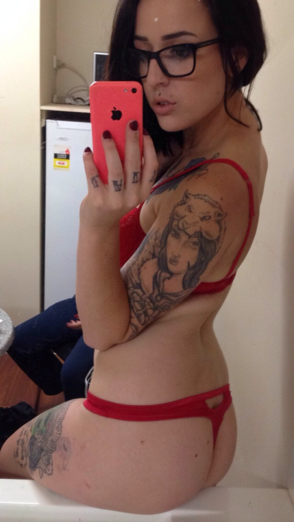 Serious tats and a red thong
