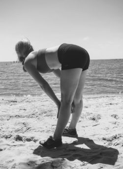 Bent over at beach.