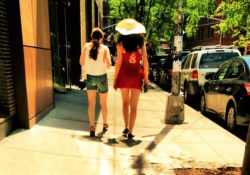 This girl in the red dress walking around Washington Square Park today