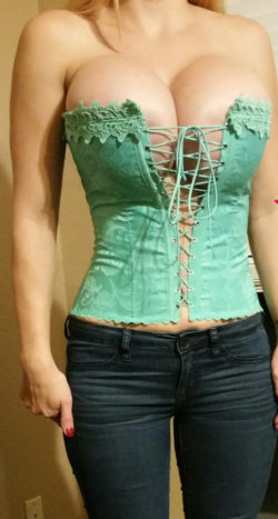 milf's juicy fake tits spilling out of corset