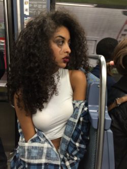 Curly hair girl in metro