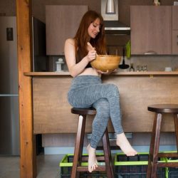 Yoga pants and a wooden bowl