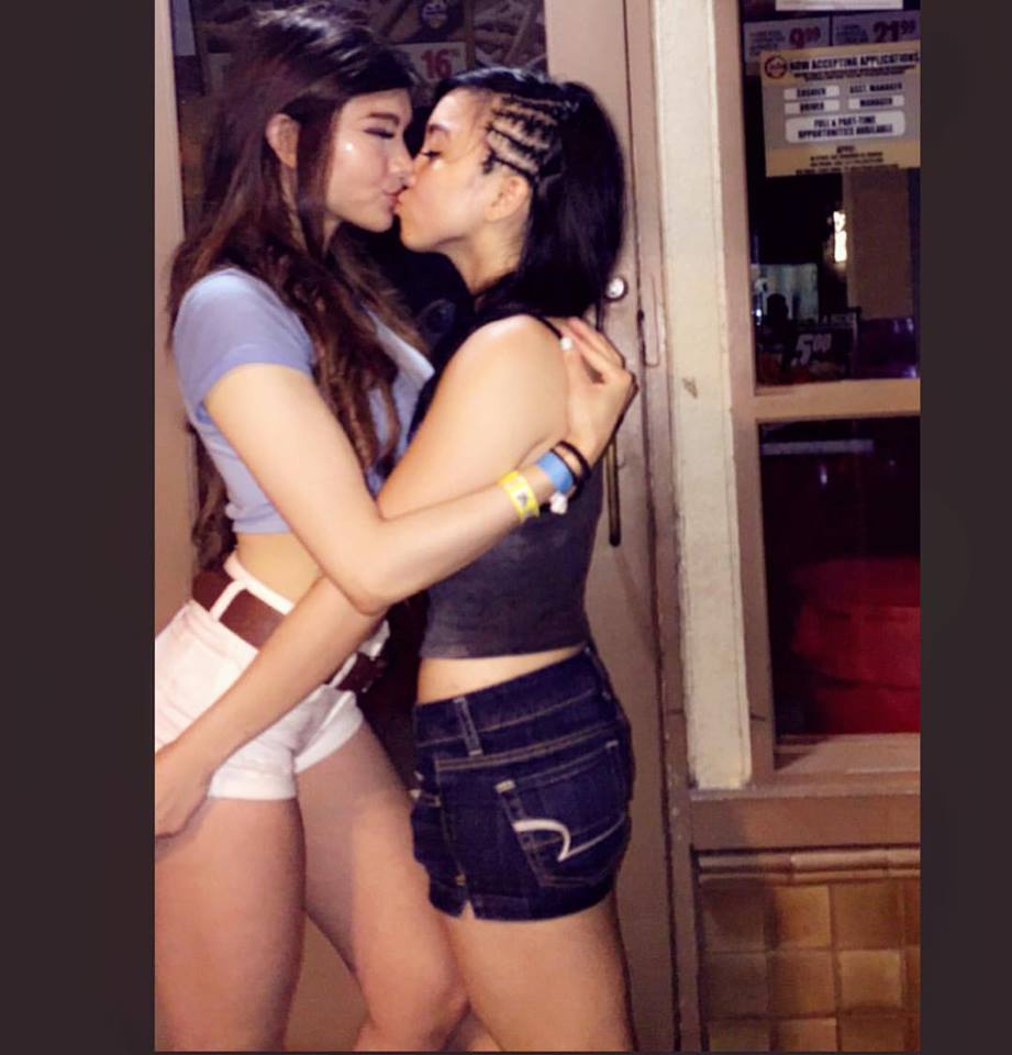 Two Asians sharing smooches