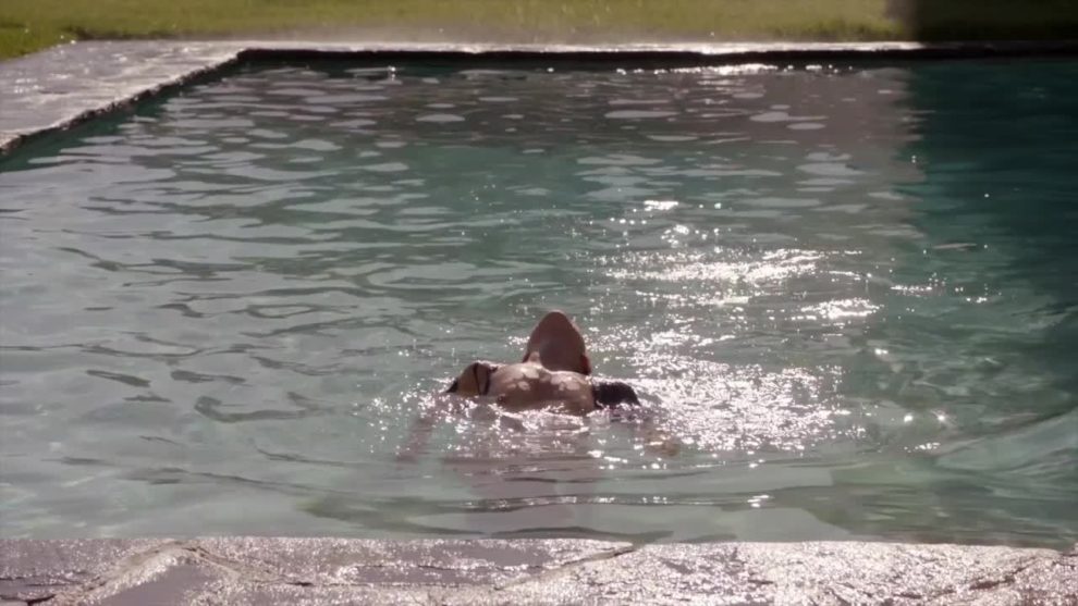 Camilla Luddington walks out of a pool. [Californication S05E0]