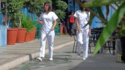 Two attractive Filipina nurses give particular care to fortunate male vacationer